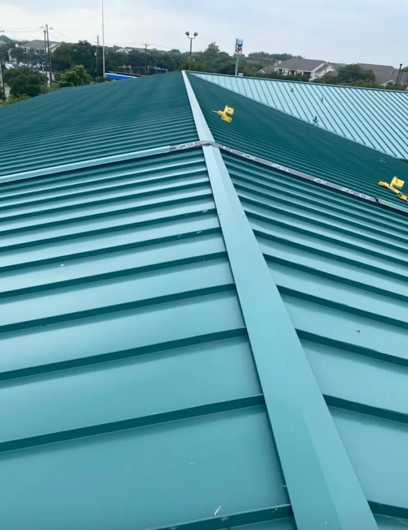 Green commercial metal roof ridge and valley for Metal Roof Repair in Grandview